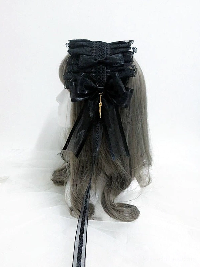 Close-up detail view of gothic lolita KC hairband showing mini side bows, intricate gold cross pendant, ruffled lace texture, and embroidered mesh fabric construction on mannequin