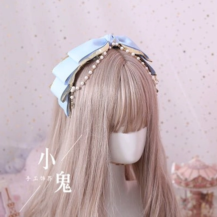 gothic lolita kc headband detail shot gold star wing brooch pearl chain lace elements close-up