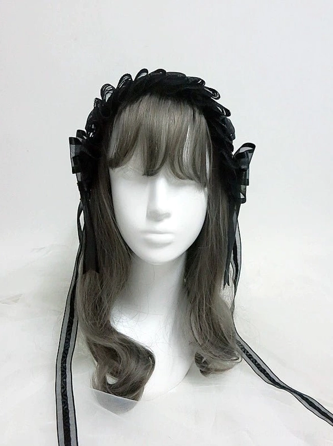 Black lolita KC headband front view on mannequin with ruffled lace design, side bow decorations, and black ribbon tie straps, gothic lolita hair accessory
