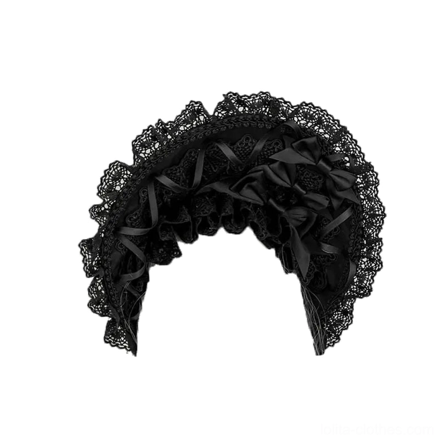 Gothic lolita lace bonnet flat lay front view, all-black ruffled lace and satin bow decorations, wearable as headband style bonnet
