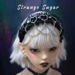 Gothic lolita lace headband with ruffled black lace base and silver heart metal buckles displayed on BJD doll model with silver-white bob hair, front close-up shot showing intricate details and layered silver chains