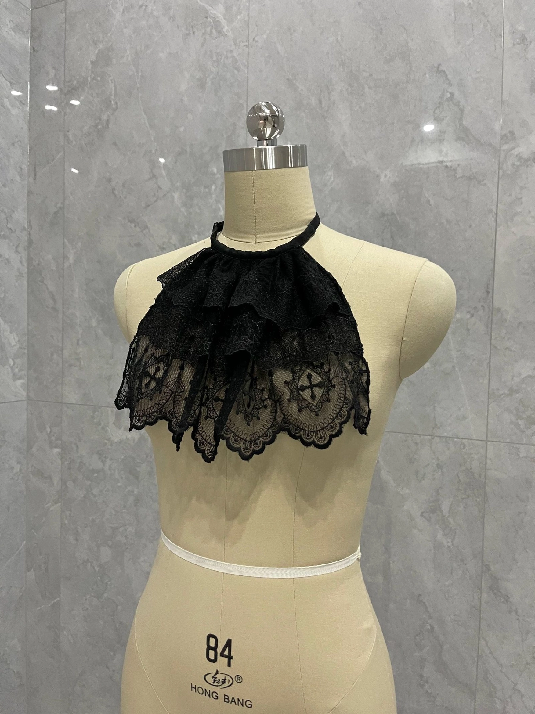 Black Gothic Lolita layered lace neck bib with adjustable halter strap and elegant tiered ruffle design