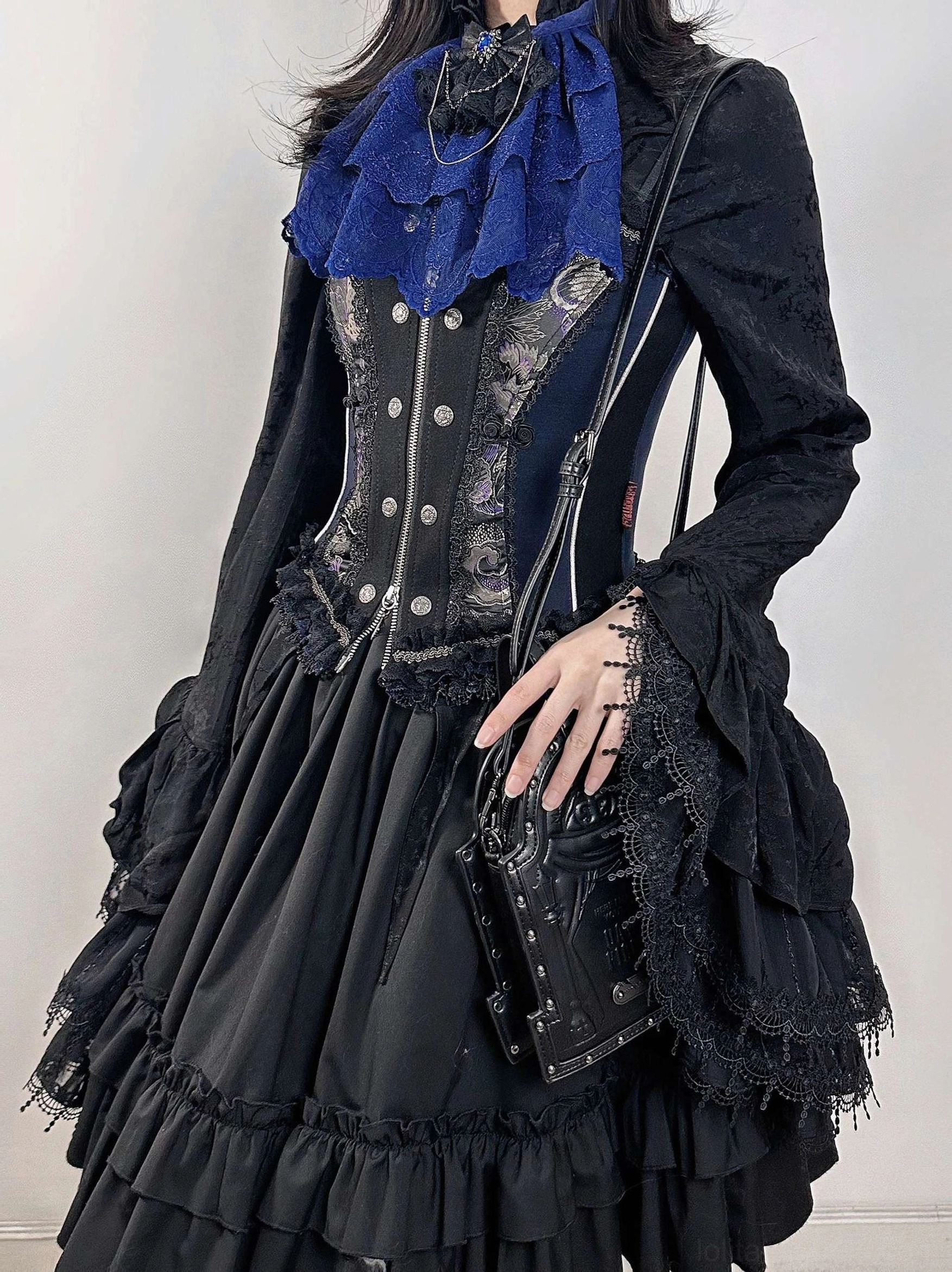 Deep blue layered lace neck bib styled with a black Gothic Lolita corset dress and ruffled bishop sleeves