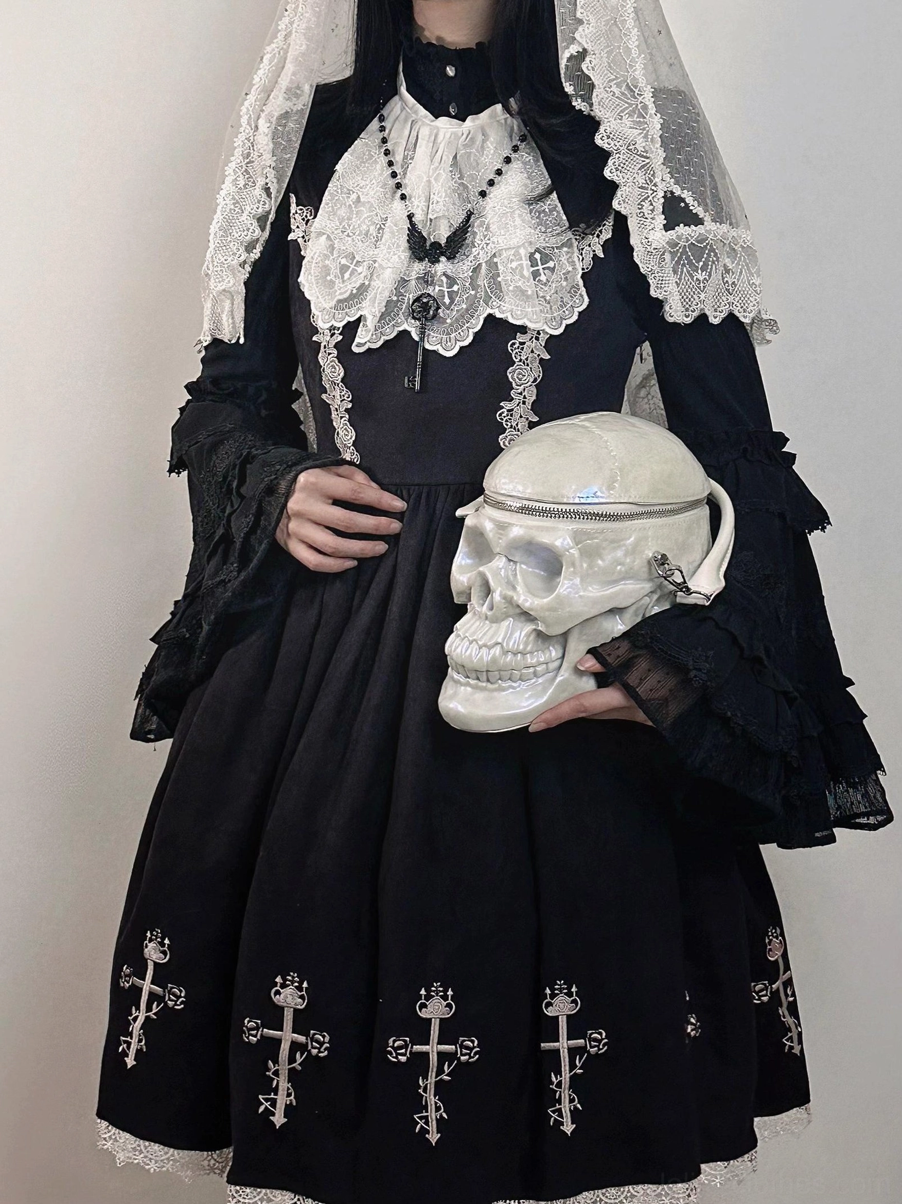 White layered lace neck bib styled with a black nun-inspired Gothic Lolita dress and veil headdress