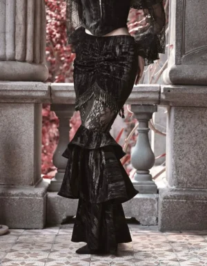 Black velvet Gothic Lolita mermaid skirt back view showing ruched fabric layered ruffled fishtail hem and sheer lace hip panel