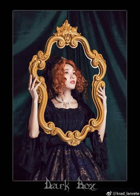 Gothic lolita fashion model styled portrait wearing pearl bow necklace with red curly hair, black lace gothic lolita dress, vintage ornate golden mirror prop, dark green velvet backdrop, half-body wearing shot