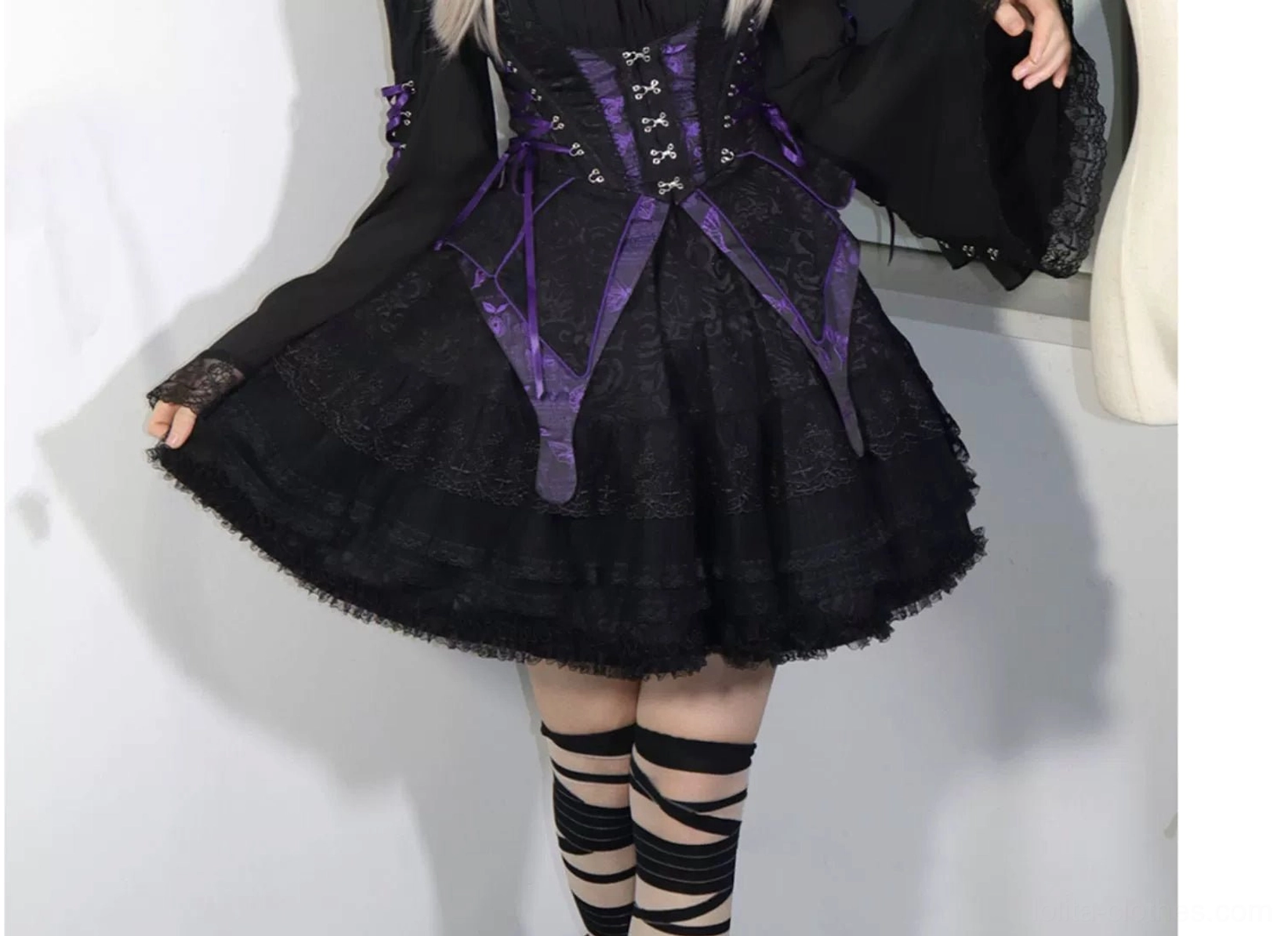 Gothic lolita model styling showing complete ensemble presentation with coordinated accessories, dark studio setting, atmospheric backdrop, and professional fashion photography aesthetic