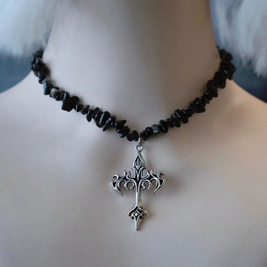 Dark gothic lolita necklace with black crushed stone beaded chain and ornate silver gothic cross pendant, vintage-inspired design shown on mannequin