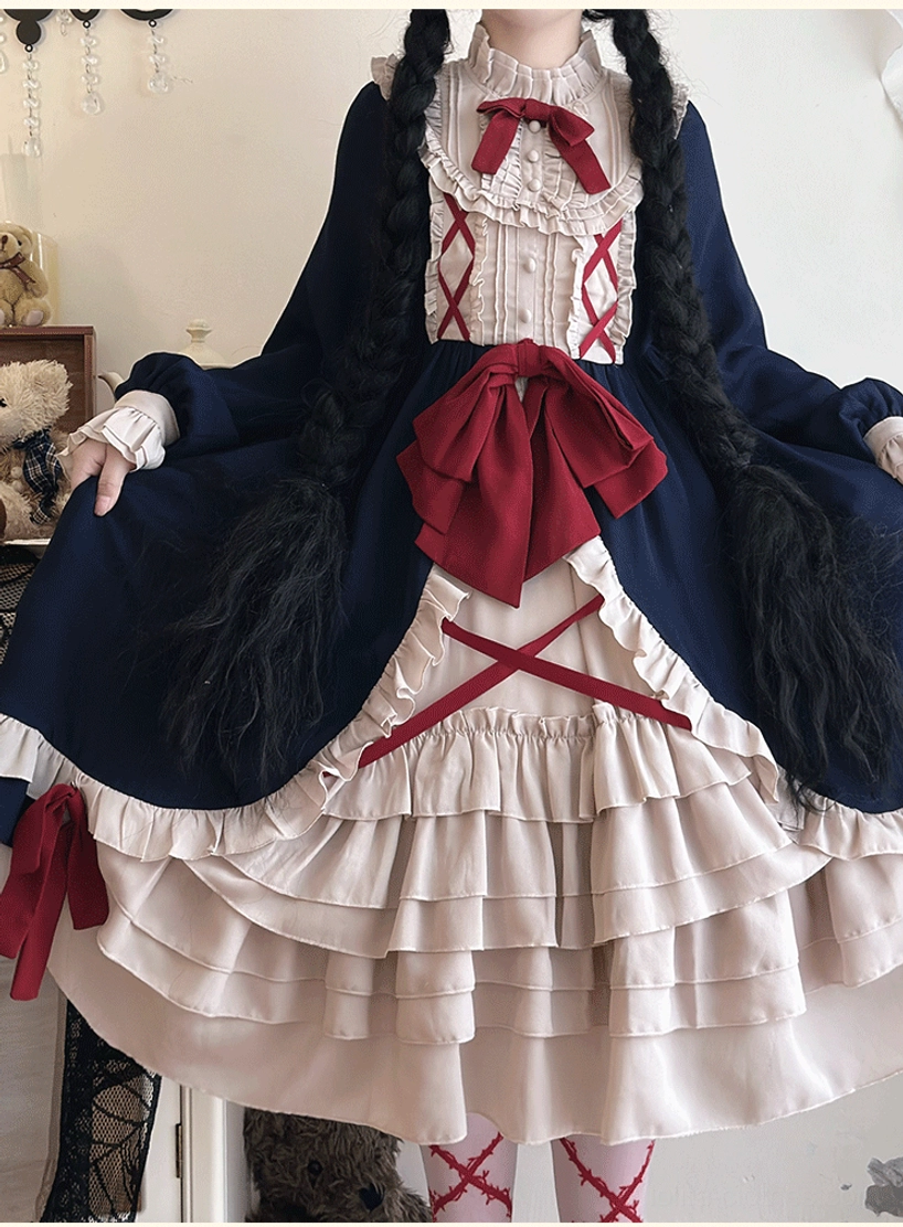 Gothic lolita dress close-up front view model twin braids large red waist bow cross ribbon details layered ruffle hem