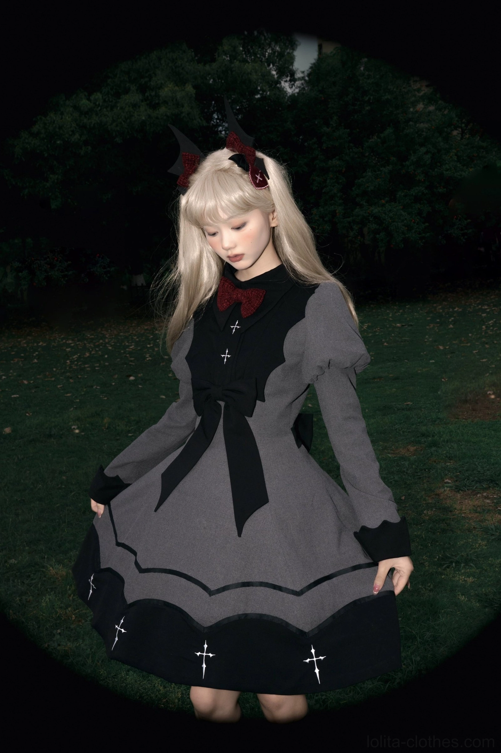 Gothic lolita OP dress overhead front view showing puffed juliet sleeves black cuffs ruffled skirt with cross embroidery