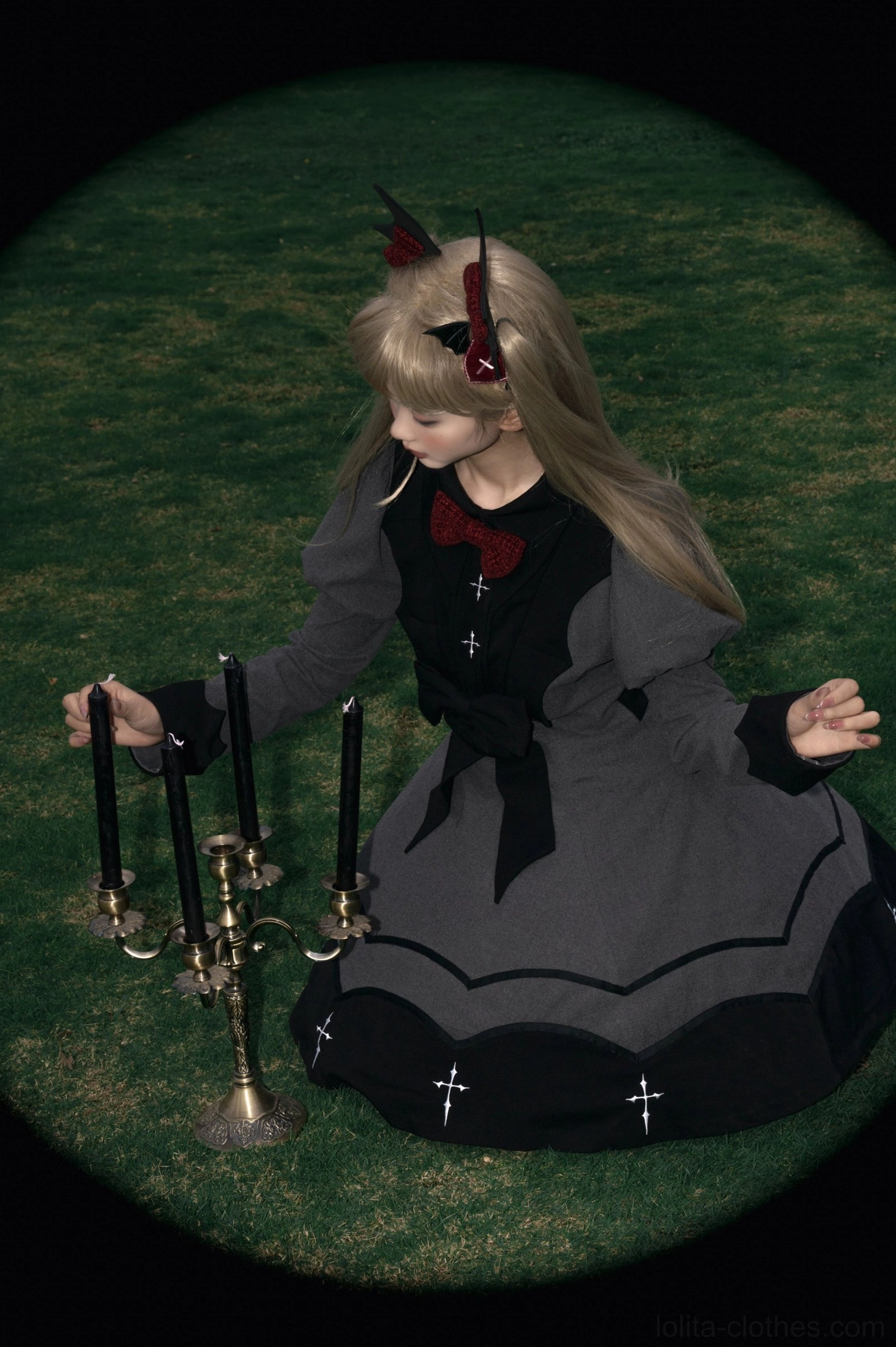 Vampire princess lolita OP dress side three-quarter view back waist bow visible wavy black trim cross embroidery candlestick