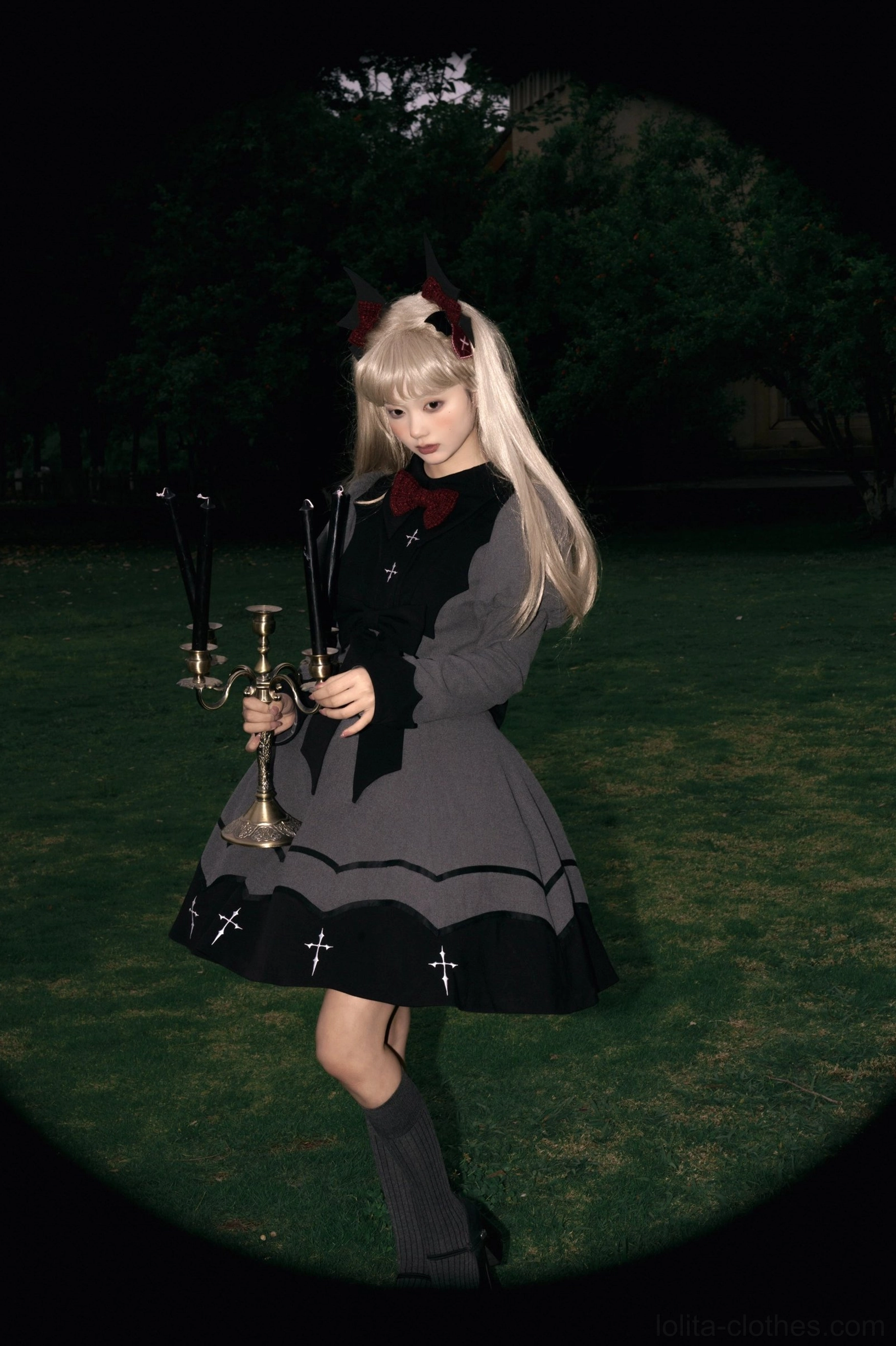 Bat-wing gothic lolita OP dress three-quarter front view contrast collar red bow necktie puffed sleeves classic silhouette