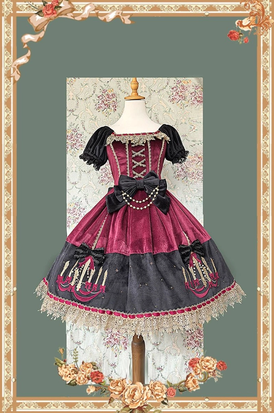 Wine red and black gothic lolita OP dress with tulle lace trim, pearl chain decorated waist bow, and chandelier prints on polka dot skirt displayed on dress form