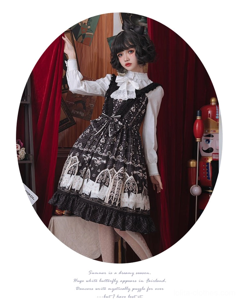 Circular cropped full body shot of gothic Lolita outfit featuring white blouse stand collar and puff sleeves coordinated with black detailed jumper skirt vintage studio
