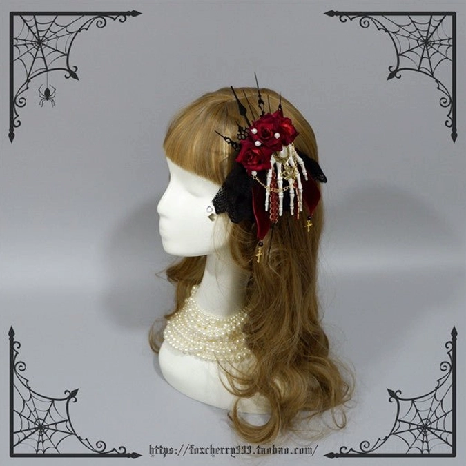 Single gothic lolita red rose skeleton hand hair clip side view on mannequin curly hair pearls lace spike accents