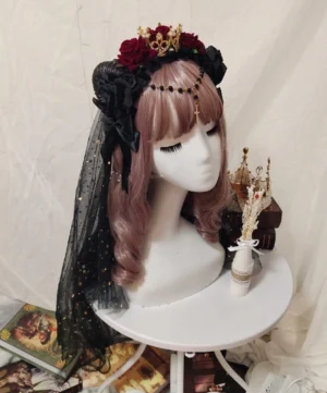 Gothic Lolita rose crown headdress with black tulle veil side profile view showing detailed rose arrangement and star ornaments
