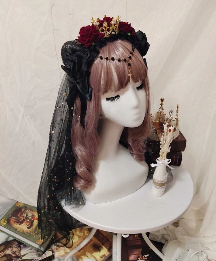 Gothic Lolita rose crown headdress with black tulle veil side profile view showing detailed rose arrangement and star ornaments