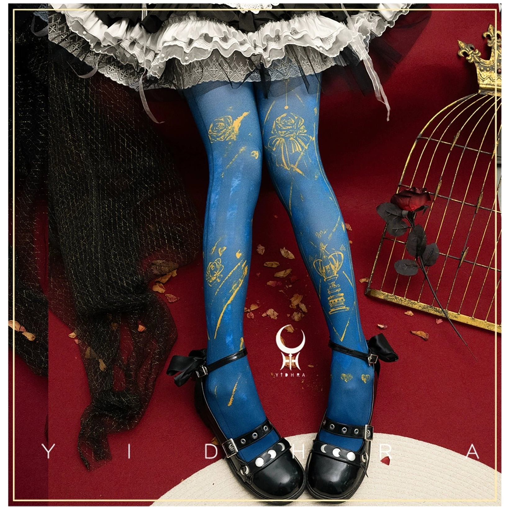 Sapphire blue Gothic Lolita rose-printed pantyhose featuring large gold rose and line patterns paired with ruffled Lolita skirt and black bow Mary Janes