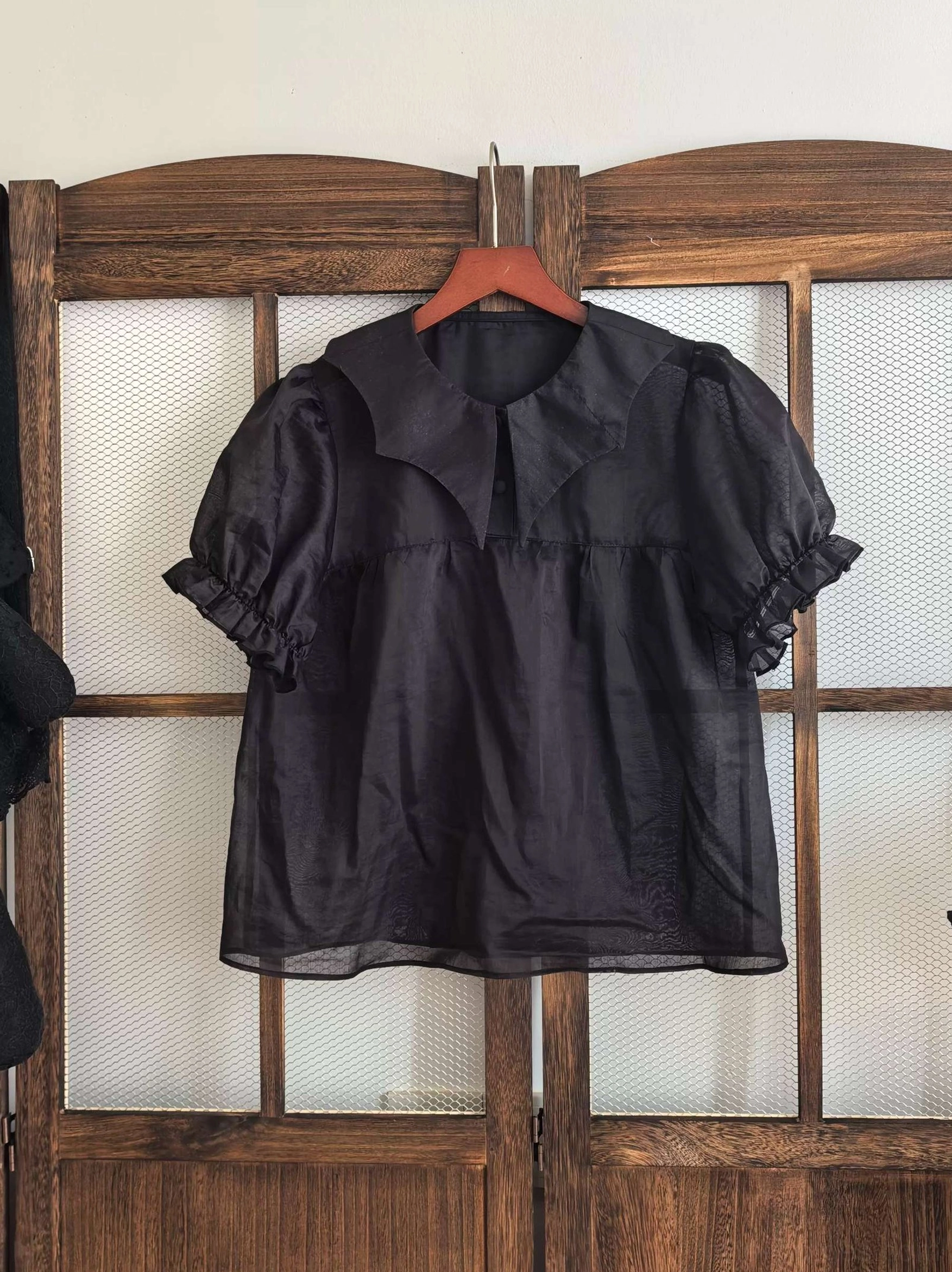 Black gothic lolita ruffled short sleeve blouse hanging display peter pan collar puff sleeves sheer lightweight tencel fabric