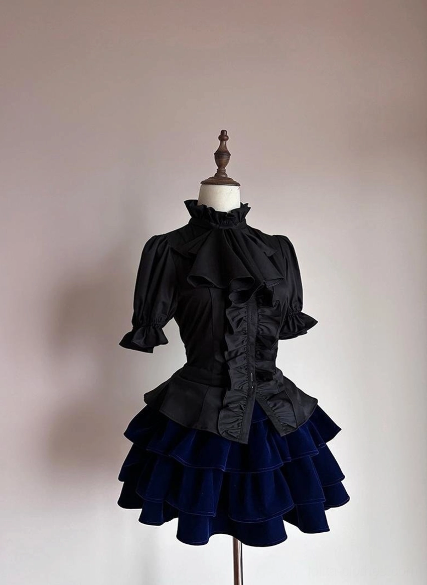 Side angle view of Gothic Lolita short-sleeve blouse showing puffed sleeve silhouette and fitted waist construction on dress form
