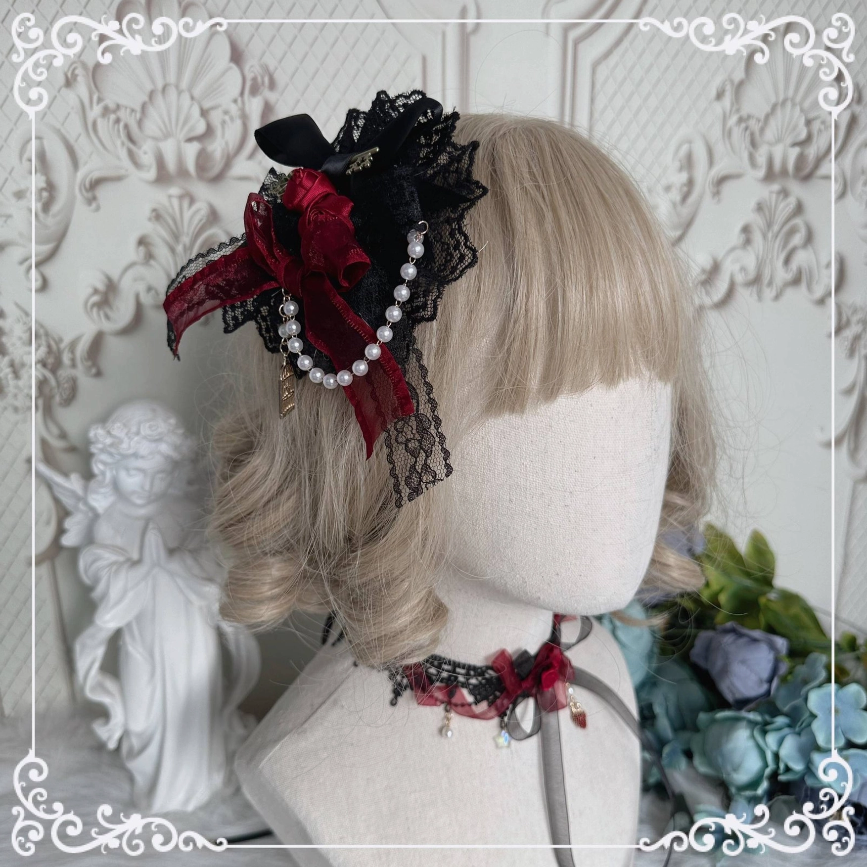 Handmade Gothic Lolita side hair clip on mannequin head with mixed black red lace, rose accents, pearl chain trim and vintage key charm detail