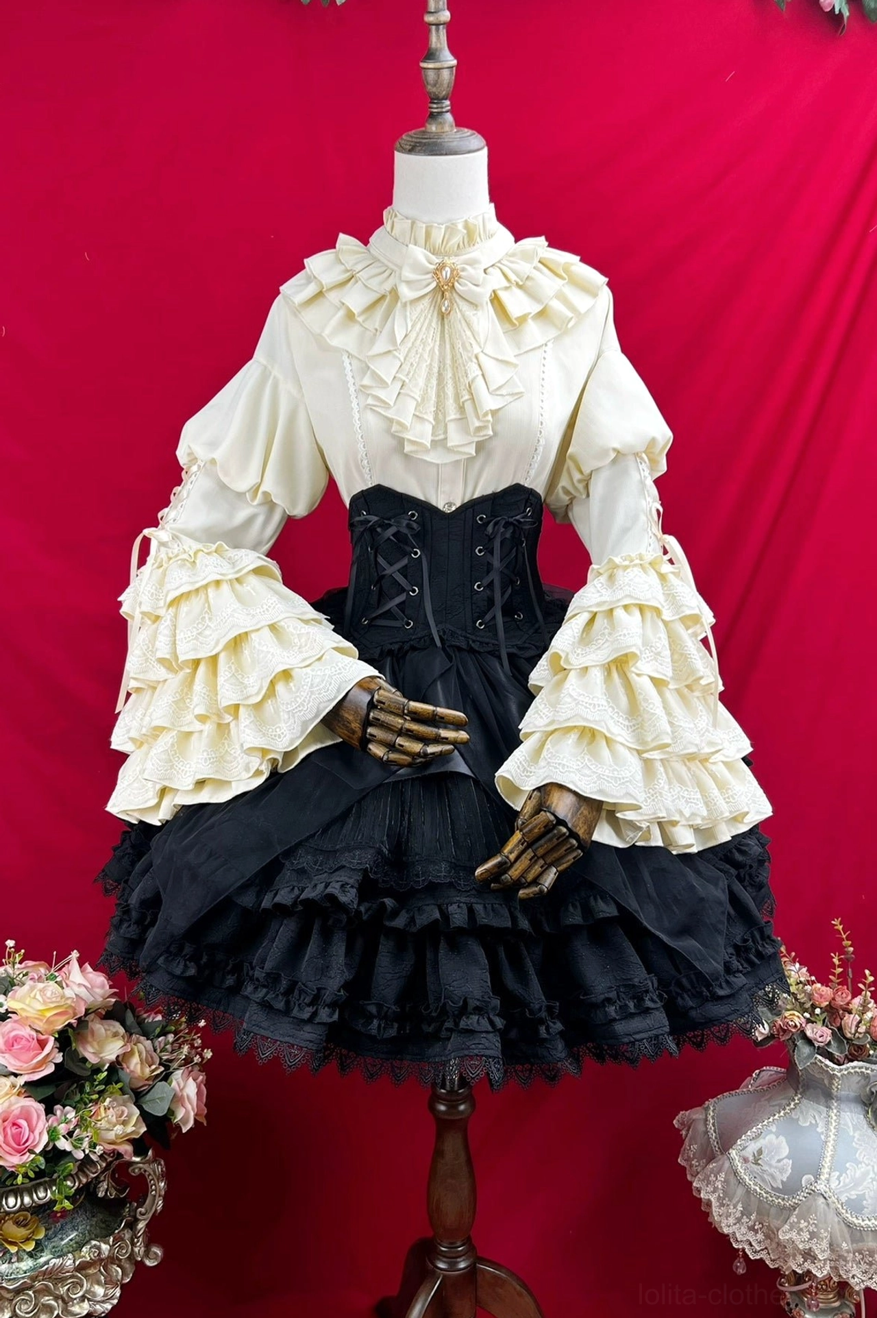 Gothic lolita sk dress set showing black and white coordinating pieces with princess sleeves lace accents and tiered ruffle construction detail perspective