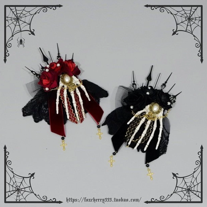 Gothic lolita skeleton hand hair clips paired display flat lay red roses white bone hands pearl decorations black lace cross charms