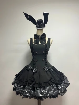 Sleeveless black gothic lolita JSK jumper skirt with double-breasted metal buttons, chest bow decoration, layered ruffled skirt featuring skull print striped hem detail on dress form mannequin