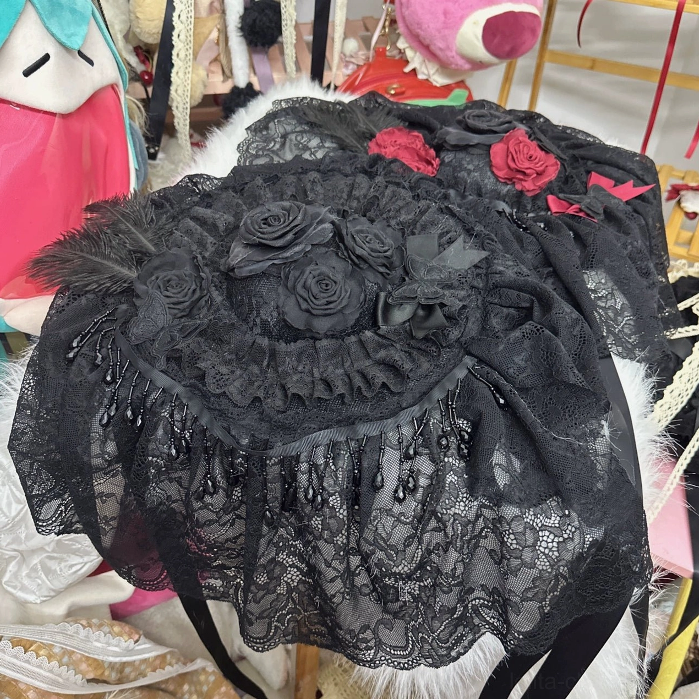 Gothic Lolita small top hat with spider pendant and black lace details front view showcase