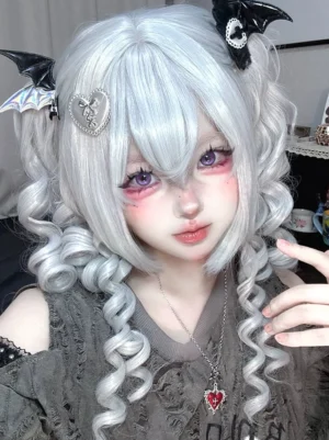 Three-quarter front view of gothic lolita cosplay wig showing natural loose spiral curls and dimensional layering on female model with styled air bangs