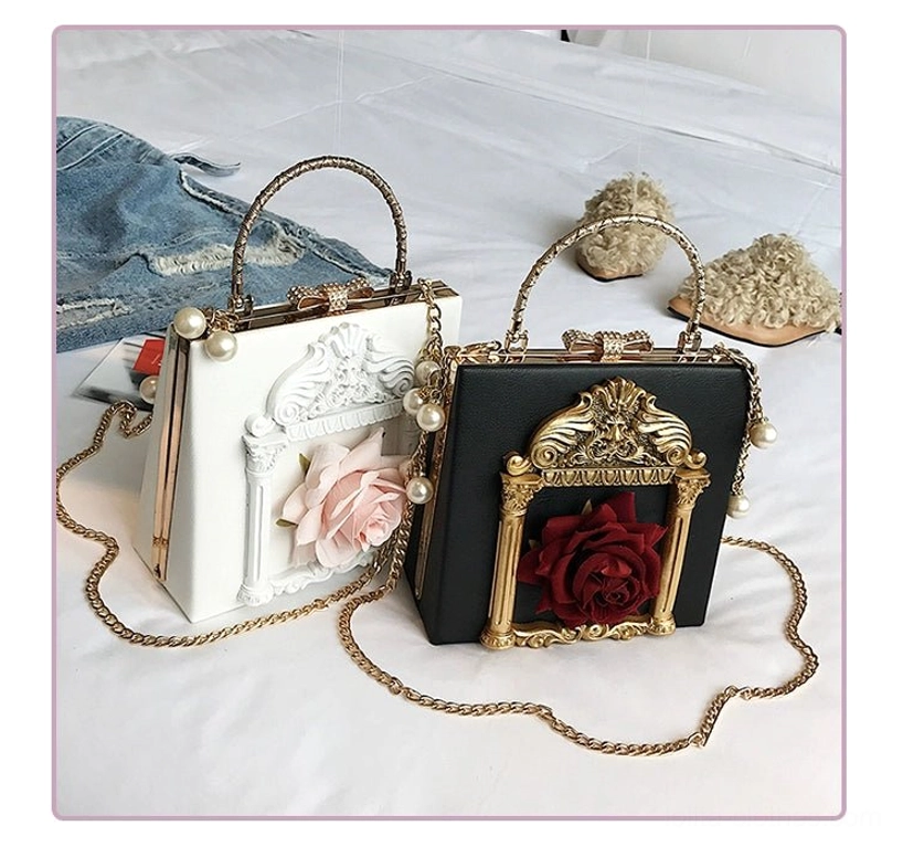 Off-white and black gothic lolita square crossbody handbags with matching baroque frame details and pearl chain strap comparison shot