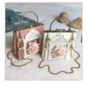 Gothic Lolita baroque square crossbody bag flat lay display featuring rose and angel pattern variants with gold and silver frames pearl chain straps on white background
