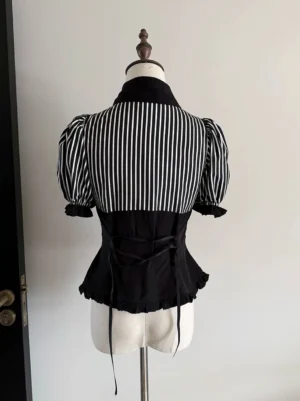 Gothic lolita blouse back view showing vertical striped panels and signature lace-up corset waist detail with ruffled sleeve cuffs