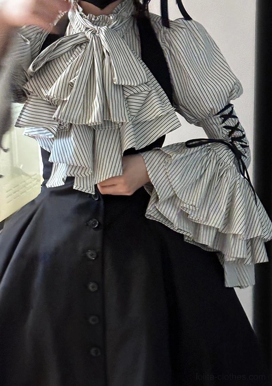Fabric care and composition label detail of Gothic Lolita striped blouse showing material blend percentages and washing instructions for garment maintenance