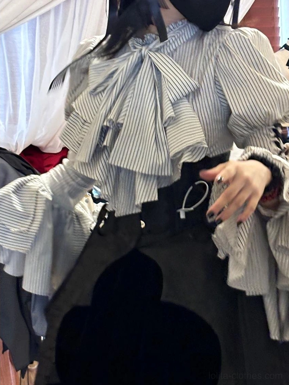 Full-body standing pose of person in Gothic Lolita striped blouse with coordinated complete outfit including skirt, stockings, shoes and accessories for authentic styling reference