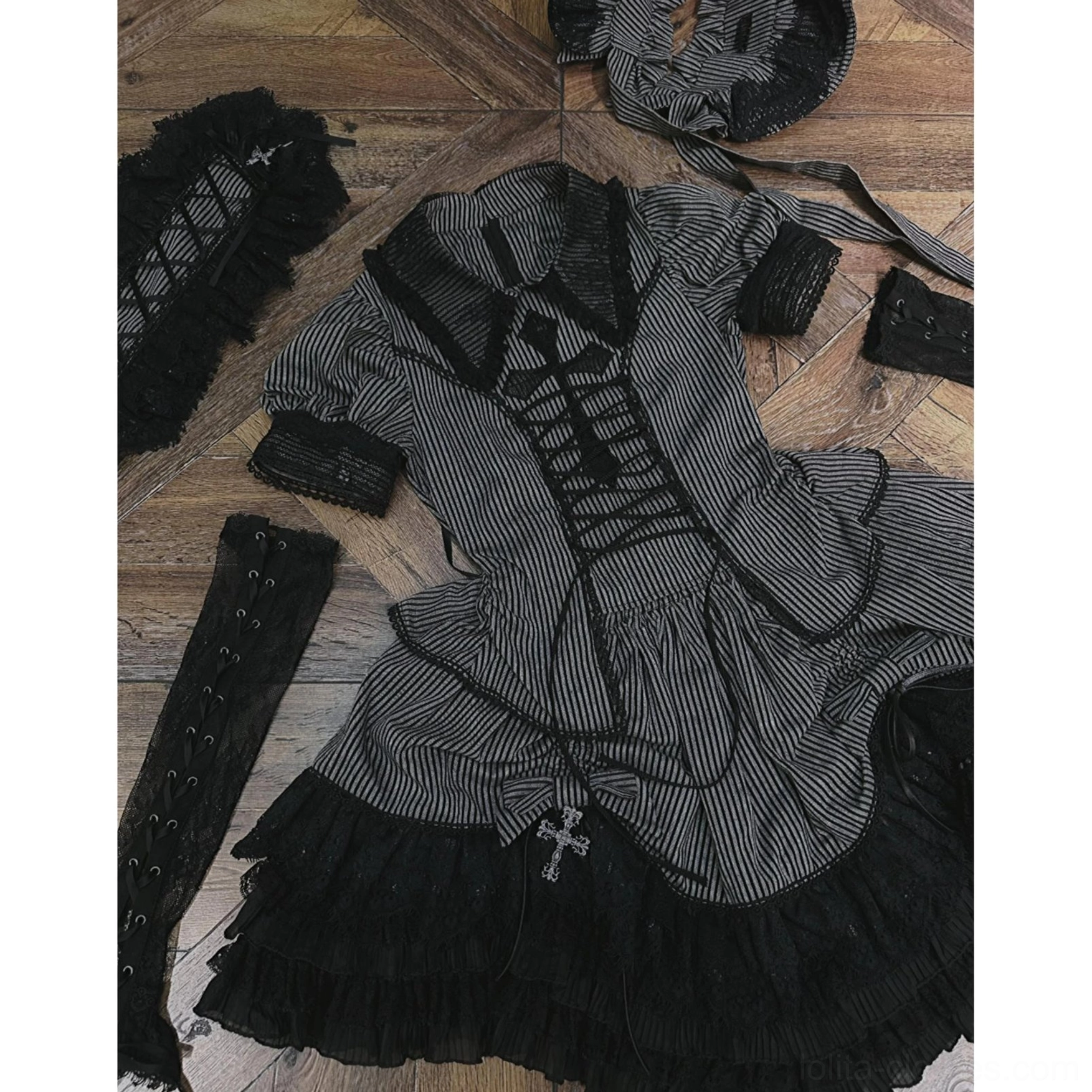 Dark striped Gothic Lolita blouse detail showing lace collar and upper bodice construction
