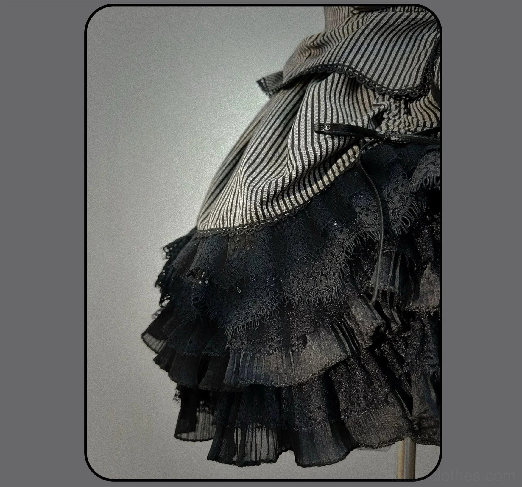 Striped Gothic Lolita coordinated blouse and skirt ensemble showing silhouette and volume from front angle