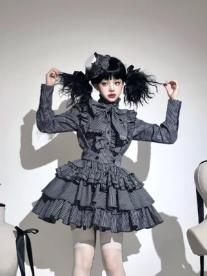Front view of gothic lolita striped blouse and skirt set with dark grey and white vertical stripes, model wearing twin curly ponytails and hair accessory