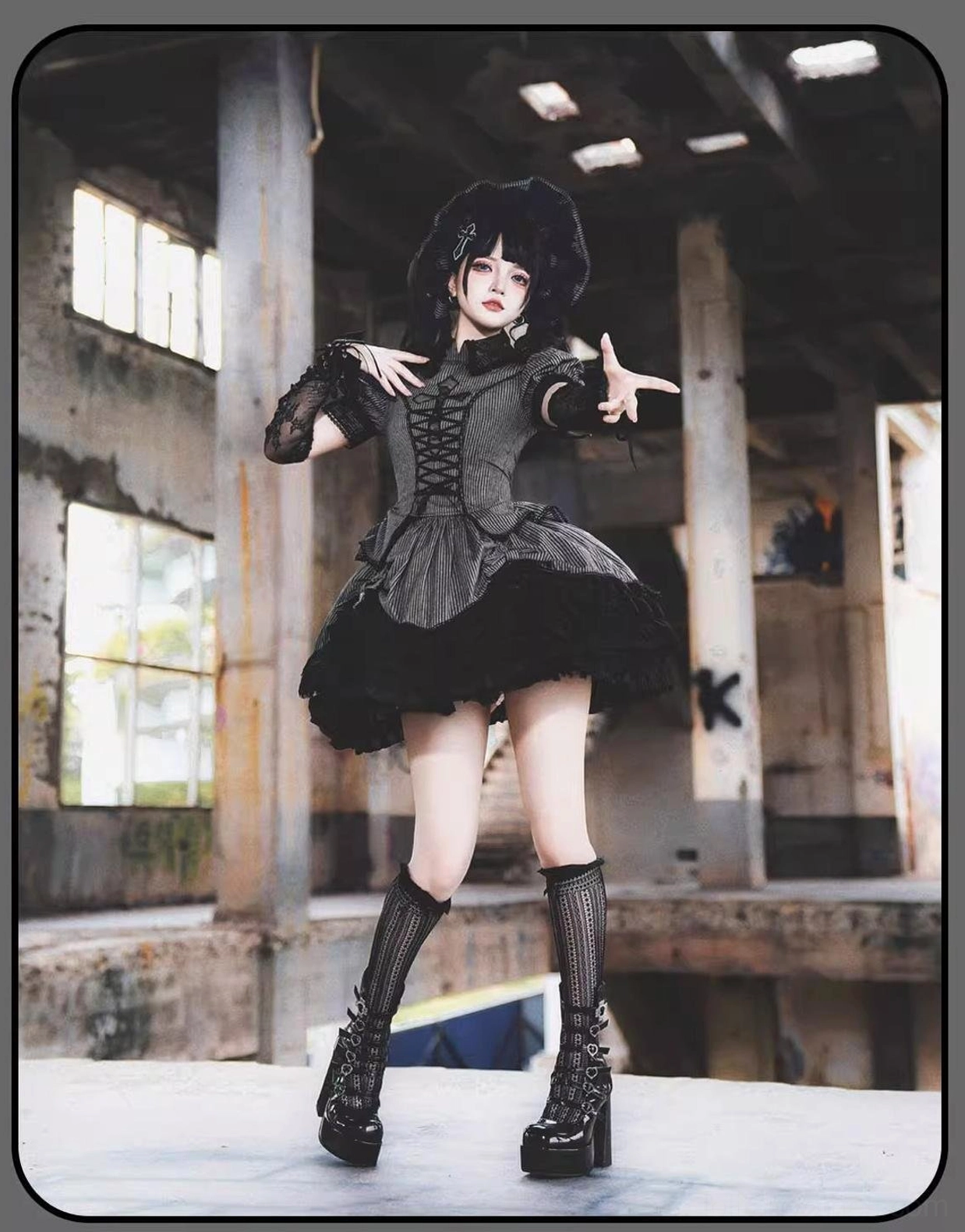 Vertical striped Gothic Lolita full outfit with lace-up bodice and black ruffled skirt hem, front full-body shot with knee-high socks and platform boots