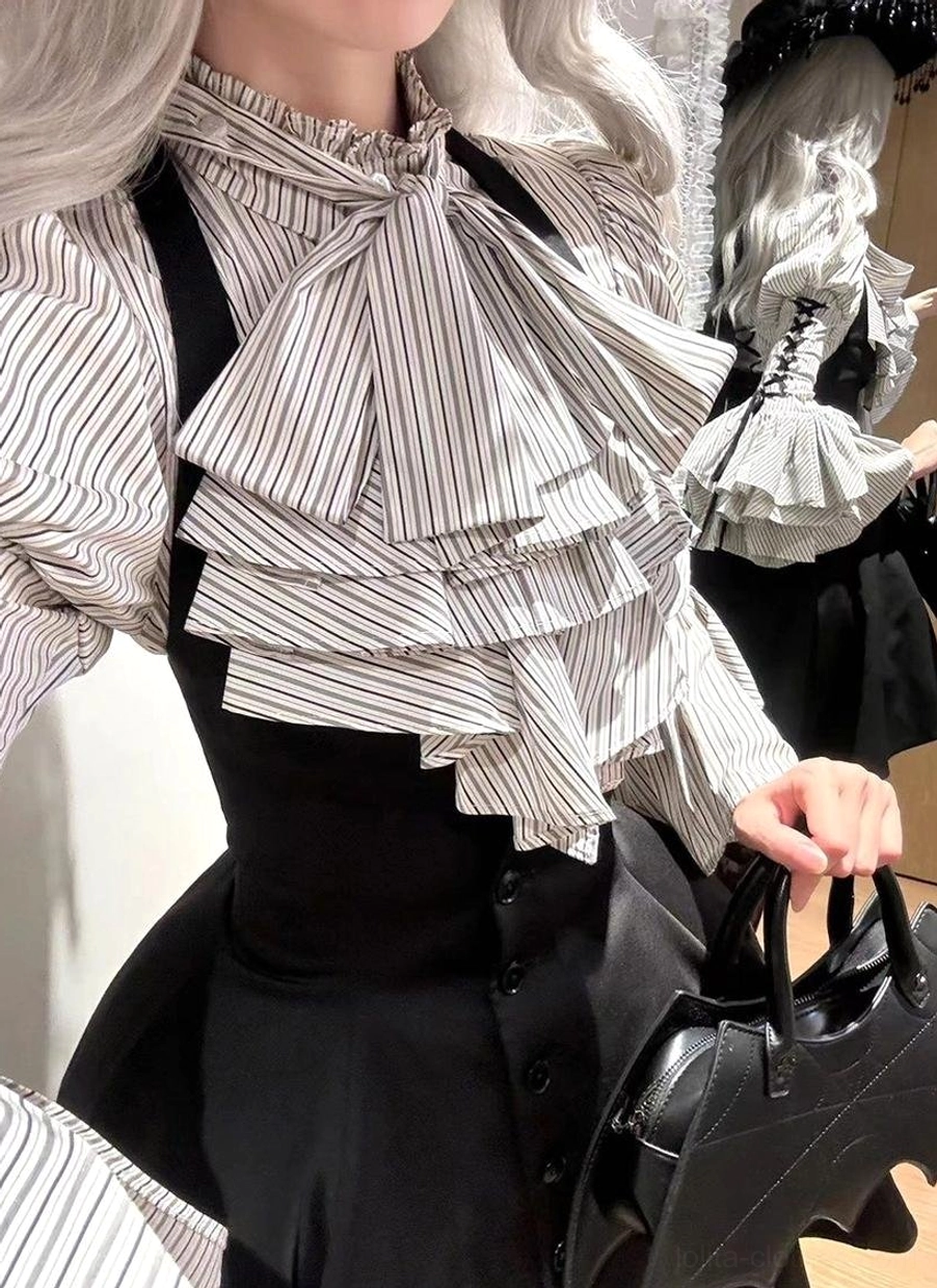 Three-quarter back angled view of Gothic Lolita striped blouse showing adjustable cross-tie system, puffed sleeve structure and high-waisted silhouette from rear perspective