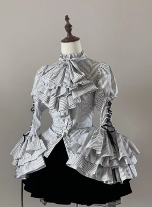 Gothic Lolita striped blouse with white base and black stripes featuring large puffed princess sleeves and layered ruffled jabot displayed on dress mannequin with black velvet tiered skirt