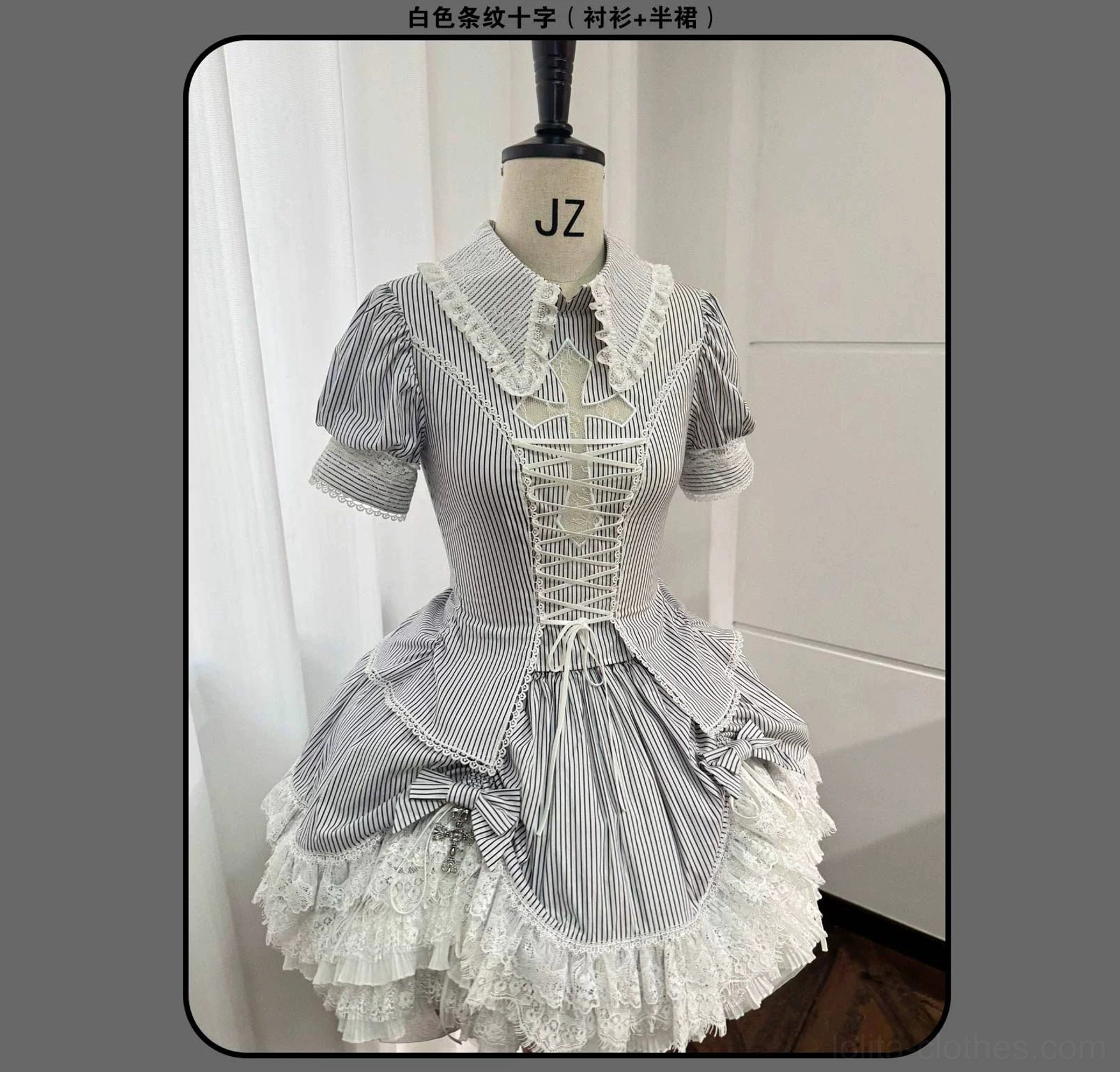 Gothic Lolita coordinate showing lace-embroidered cross at bust with oxidized pendant and vertical stripe pattern integration