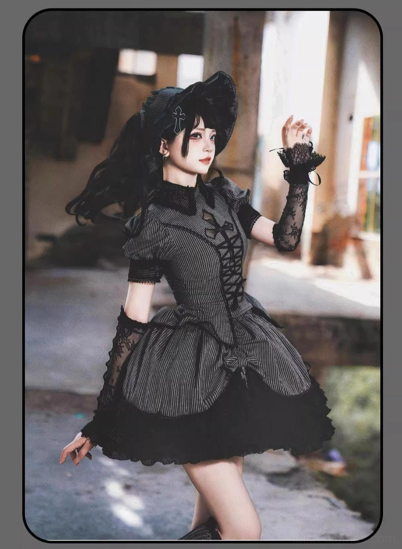 Striped Gothic Lolita two-piece set with Peter Pan collar and front lace-up corset, three-quarter side profile showing fingerless lace elbow gloves