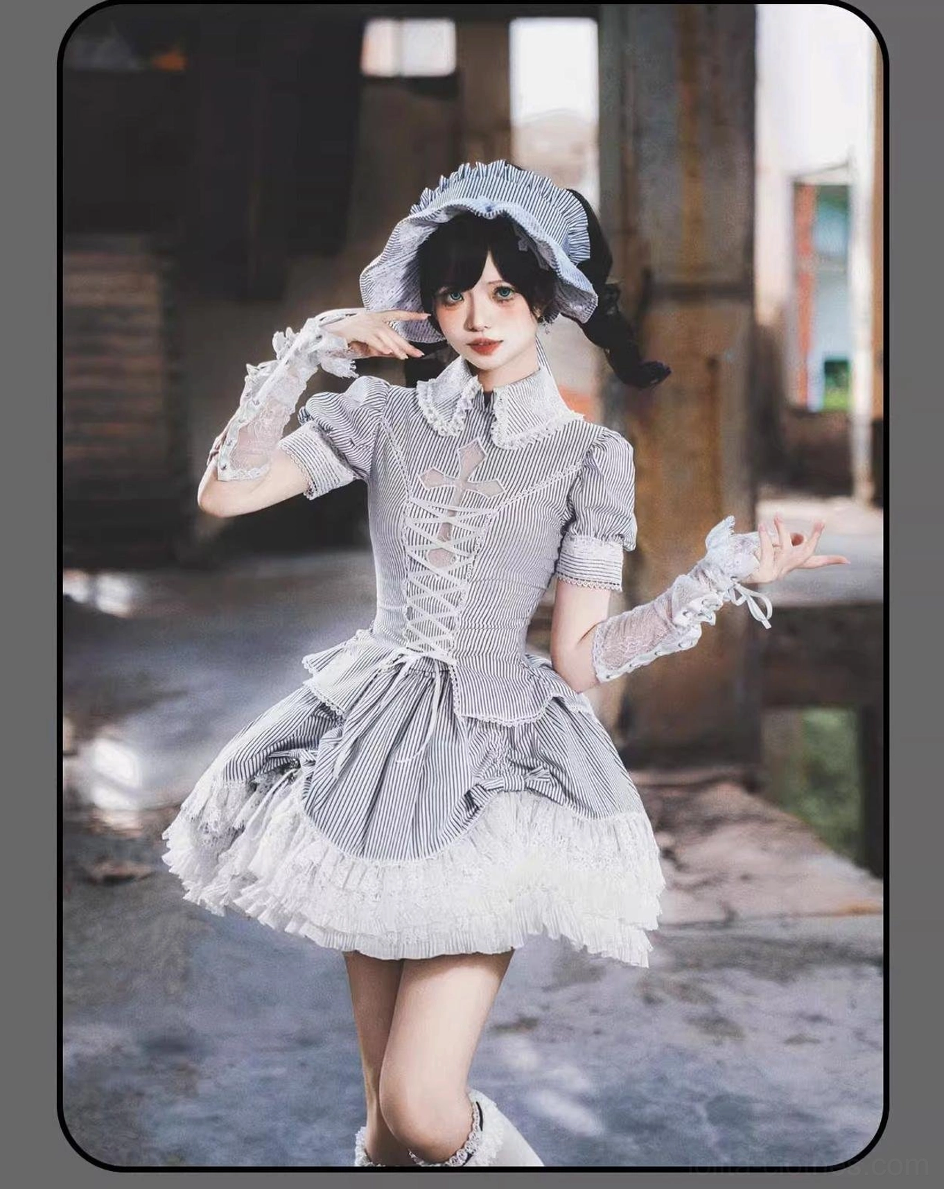 Striped Gothic Lolita skirt showing elastic waistband adjustment and tiered ruffle layer structure