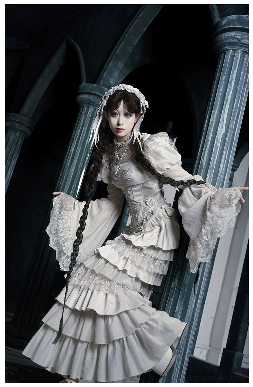 Gothic lolita styling composition showing coordinated accessories veil chain necklace placement arrangement
