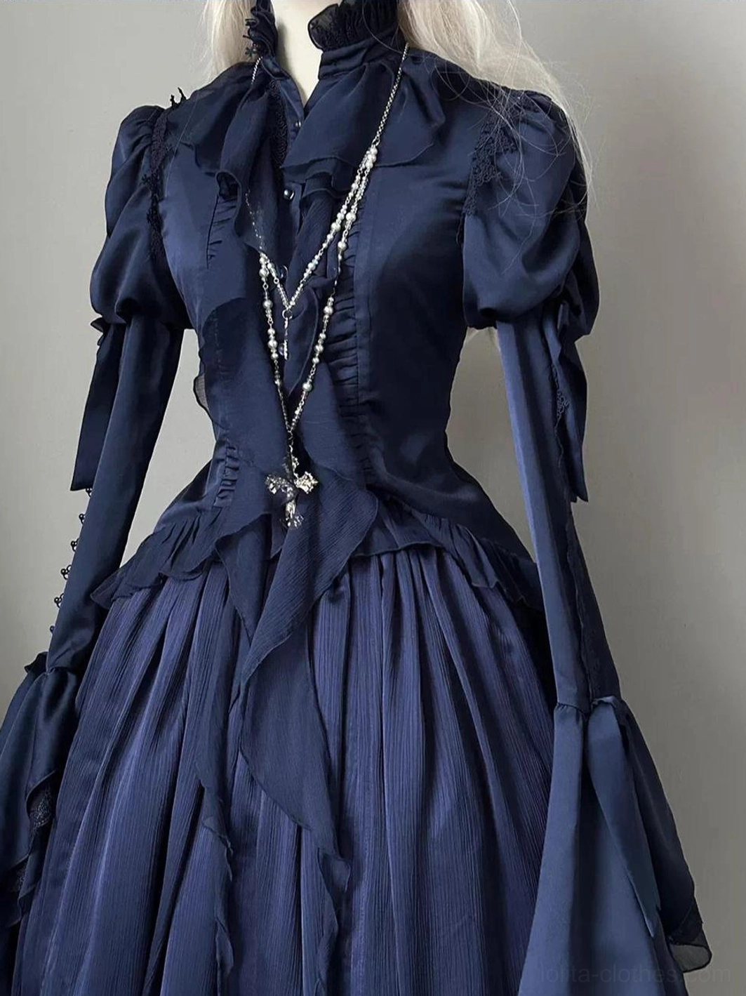 Gothic lolita swallowtail blouse full-length mannequin display showing silhouette with button front closure, fitted waist, and dramatic hem flounce