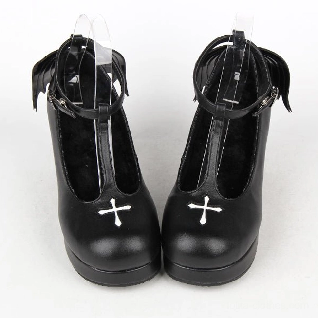Frontal pair view of Gothic Lolita T-strap high heel shoes with white cross embroidery, polished black leather, rounded toe design, block high heel construction