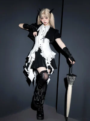 Gothic lolita three-piece set full-body front view on blonde model wearing black and white outfit with cross pendant, fingerless gloves, thigh-high stockings and platform boots in dark studio