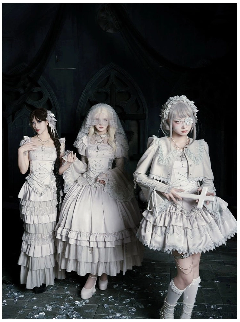 Gothic lolita trio outfit collection featuring three off-white dress styles with one model holding cross prop group three quarter view