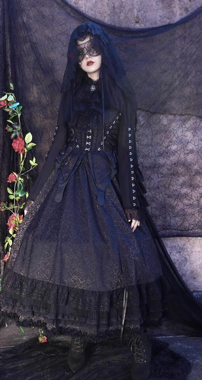 Gothic lolita dress set featuring black veil overlay, intricate lace mask detail with red rose embellishment, high-neck long-sleeve structured blouse, corset waist design, and dramatic ruffled lace hem